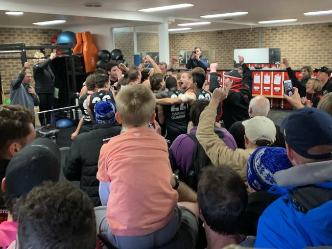 Frankston players sing the song in packed rooms after defeating North Melbourne.