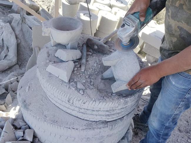 Volcanic stone dishware in the process of creation by a family business in Mexico.