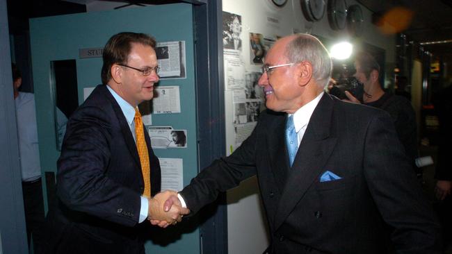 Prime Minister John Howard, left, was almost 20 years younger than Biden and Trump when he saw off the challenge from Mark Latham in 2004. Picture: John Feder