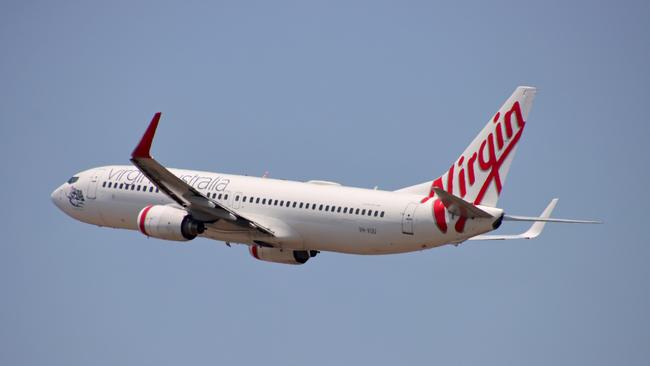 Virgin Australia plane departing from Brisbane Airport Pictures David Clark Photography