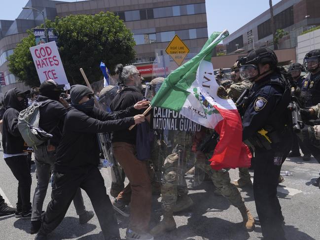 Protesters clash with authorities in downtown Los Angeles. Picture: AP