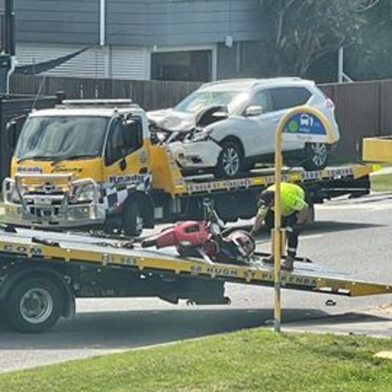 The vehicles are loaded on to tow trucks. Picture: Chelsea Garrett