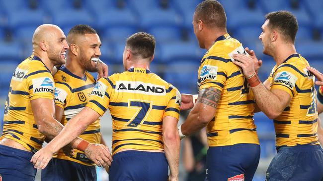 Peni Terepo of the Eels celebrates a try with team mates during the Round 2 NRL match between the Gold Coast Titans and the Parramatta Eels. He has taken a break due to a health scare.