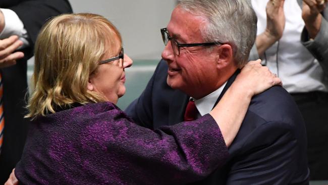 Mr Swan is congratulated by Jenny Macklin. Picture: AAP