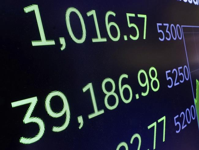 A board above the trading floor of the New York Stock Exchange shows the closing number for the Dow Jones industrial average, Tuesday, April 22, 2025. (AP Photo/Richard Drew)