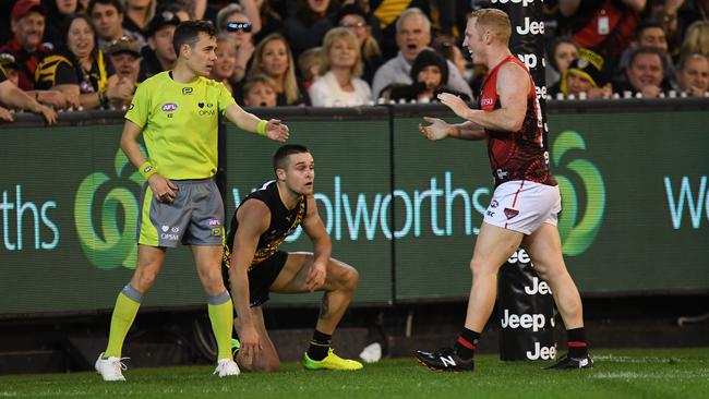 Umpire Curtis DeBoy awards Essendon’s Josh Green a free kick in the square after Richmond’s Jayden Short was adjudged to have deliberately rushed the behind. Picture: AAP