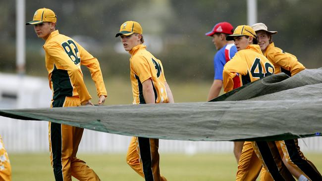 The covers came out as rain interrupted play. Picture: John Appleyard