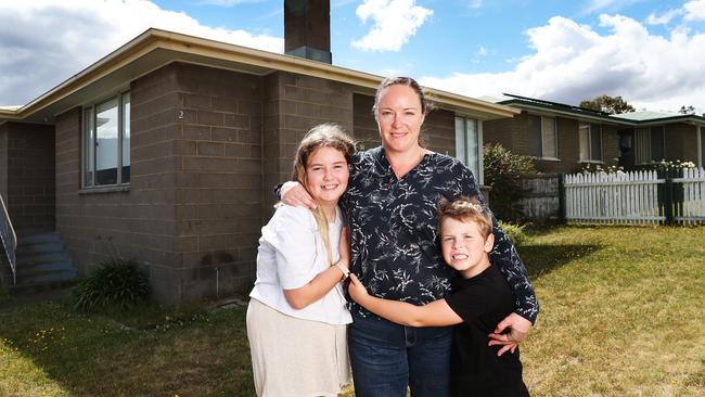 Rebeckah Howard first homebuyer with children Isabel 11 and Glenn 6 at their new home in Herdsmans Cove. Picture: NIKKI DAVIS-JONES