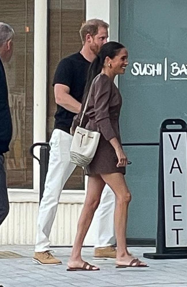 Meghan looked chic in a brown mini-dress for the sushi date. Picture: TMZ/Backgrid