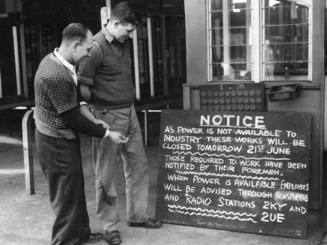 A power shortage notice sign greets employees at one of the large Sydney metal works in June 1949. Picture: Herald Sun