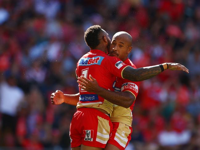 BRISBANE, AUSTRALIA - MARCH 05: Hamiso Tabuai-Fidow of the Dolphins celebrates a try during the round one NRL match between the Dolphins and Sydney Roosters at Suncorp Stadium on March 05, 2023 in Brisbane, Australia. (Photo by Chris Hyde/Getty Images)