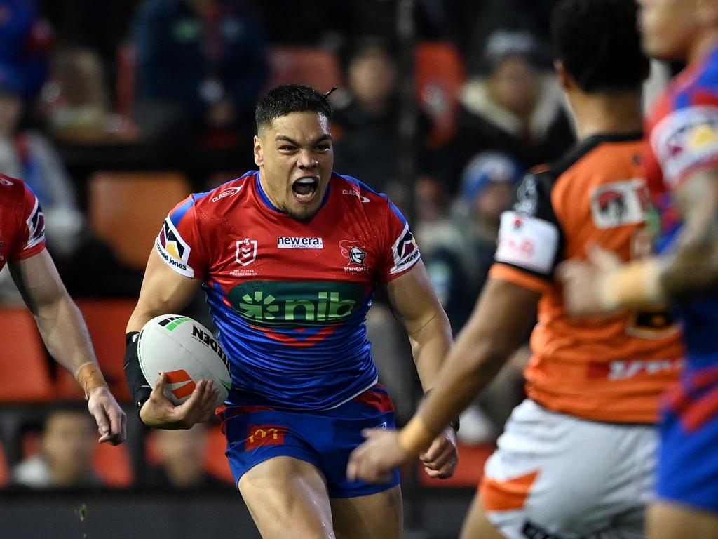 Leo Thompson takes a hit up for the Knights. Credit: NRL Images.