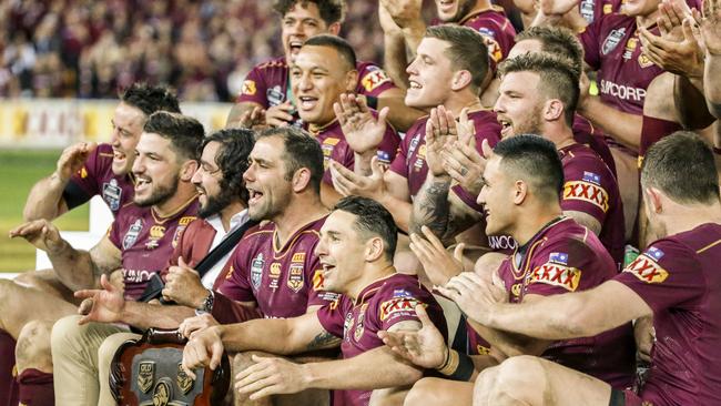 Maroons players celebrate with the Shield after their win during State of Origin Game 3 between the Queensland Maroons and the NSW Blues at Suncorp Stadium in Brisbane, on Wednesday, July 12, 2017. (AAP Image/Glenn Hunt) NO ARCHIVING, EDITORIAL USE ONLY