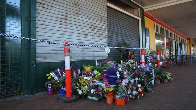 Floral tributes were left at the front of the cafe in the wake of the disaster. PICTURE: BRENDAN RADKE