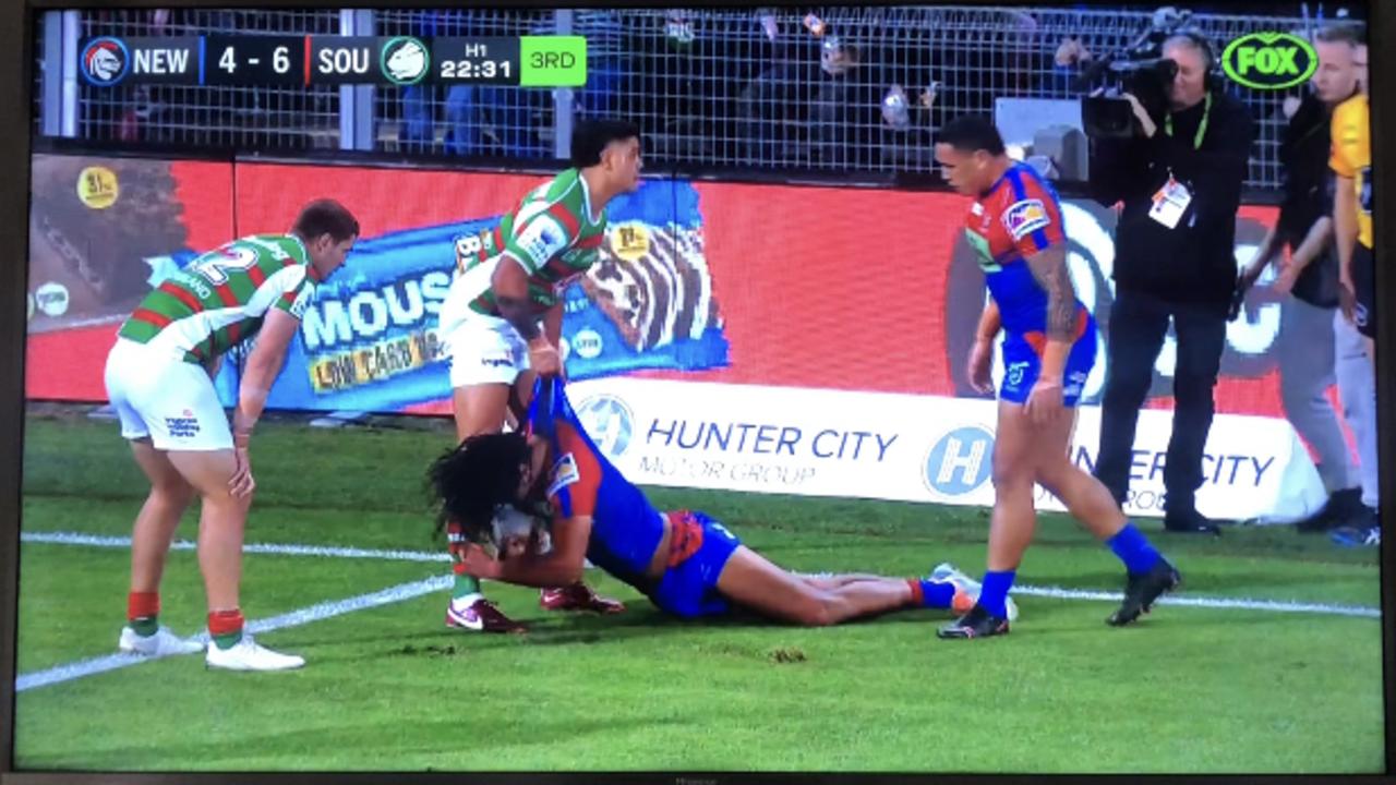 Latrell Mitchell attempts to lift Dominic Young after hitting him in the head. Picture: Fox Sports