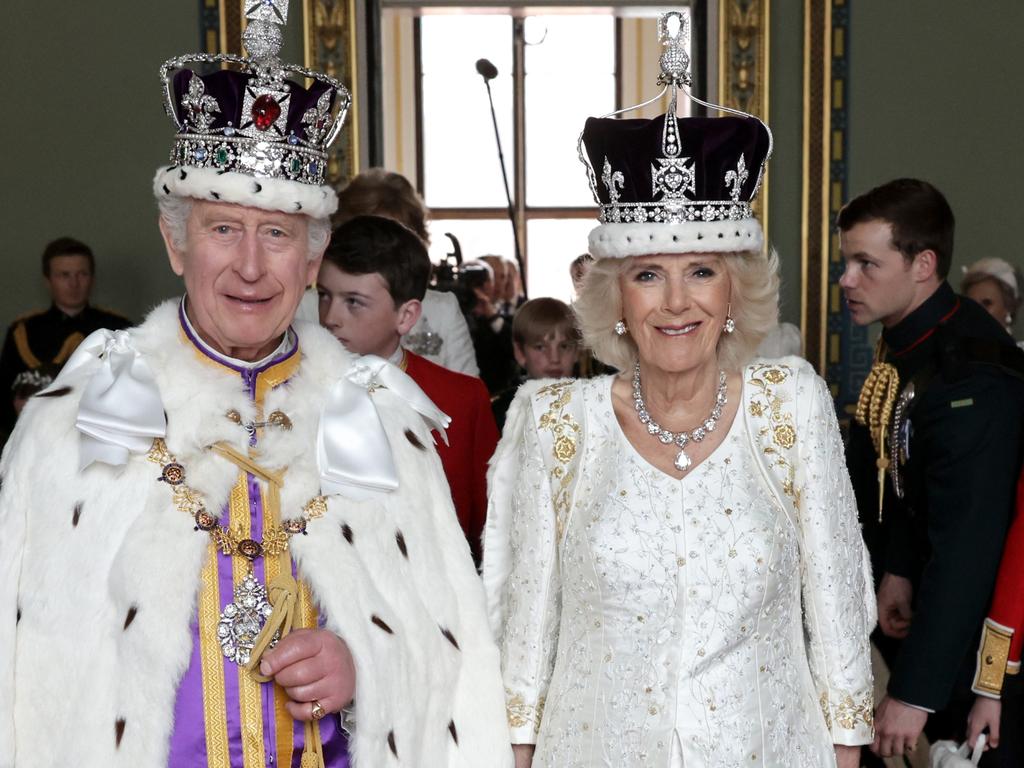 King Charles III and Queen Camilla pose and smile after their Coronation, at Buckingham Palace. Picture: Getty