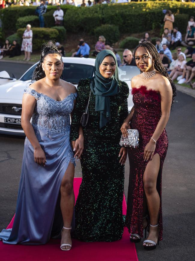 Arriving at Harristown State High School formal are (from left) Irene Pepena, Huda Mohamed and Talitha Pinia at Highfields Cultural Centre, Friday, November 18, 2022. Picture: Kevin Farmer