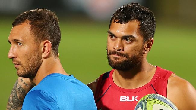 BRISBANE, AUSTRALIA - SEPTEMBER 18: (EXCLUSIVE COVERAGE) Quade Cooper and Karmichael Hunt talk during a Queensland Reds training session at Ballymore Stadium on September 18, 2014 in Brisbane, Australia. (Photo by Chris Hyde/Getty Images)