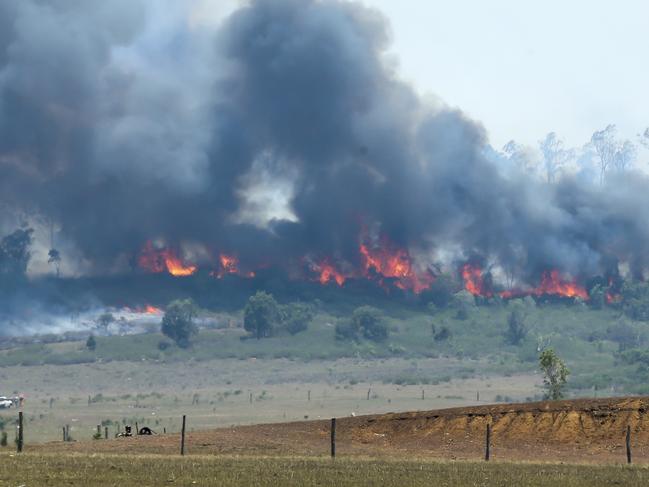 A hill ablaze at Ambrose in central Queensland. Picture: Mark Cranitch