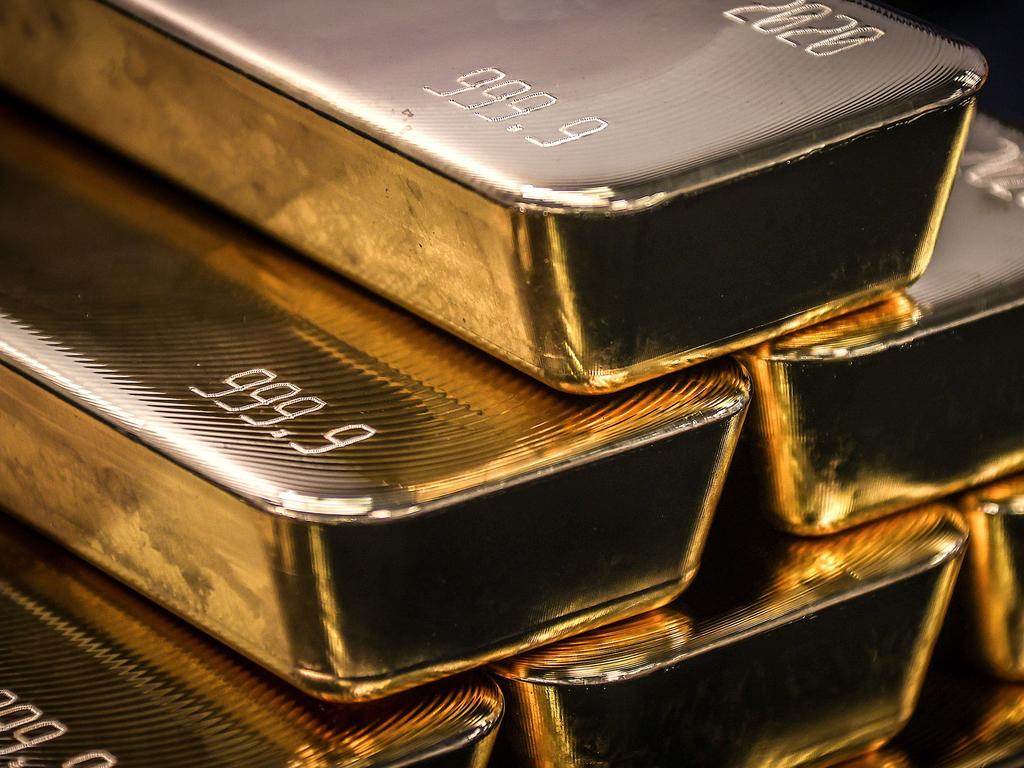 TOPSHOT - Gold bullion bars are pictured after being inspected and polished at the ABC Refinery in Sydney on August 5, 2020. - Gold prices hit 2,000 USD an ounce on markets for the first time on August 4, the latest surge in a commodity seen as a refuge amid economic uncertainty. (Photo by DAVID GRAY / AFP)