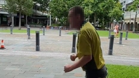 A man has been charged after allegedly punching a police officer in the head during a press conference in the Cairns CBD.