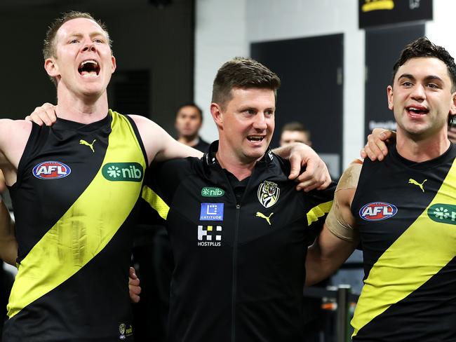 SYDNEY, AUSTRALIA - JUNE 04: Jack Riewoldt of the Tigers, Tigers interim head coach Andrew McQualter and Tim Taranto of the Tigers sing the team song as they celebrate victory during the round 12 AFL match between Greater Western Sydney Giants and Richmond Tigers at GIANTS Stadium, on June 04, 2023, in Sydney, Australia. (Photo by Mark Kolbe/Getty Images)