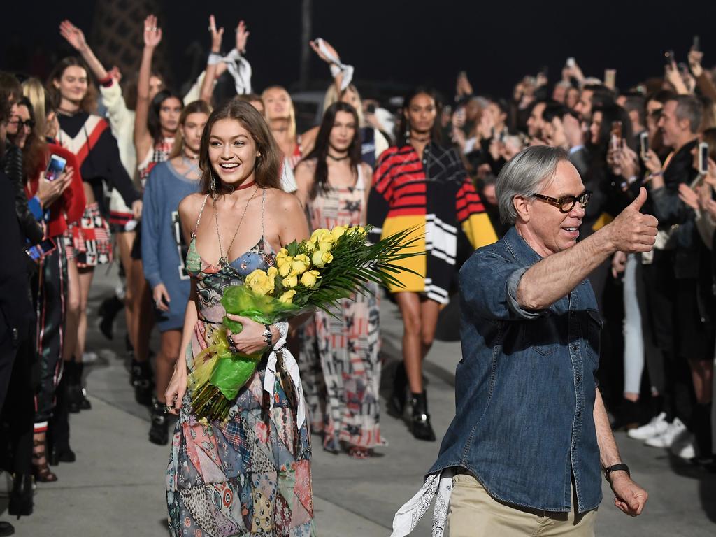 Model Gigi Hadid and fashion designer Tommy Hilfiger walk the runway at the TommyLand Tommy Hilfiger Spring 2017 Fashion Show on February 8, 2017 in Venice, California. Picture: Getty