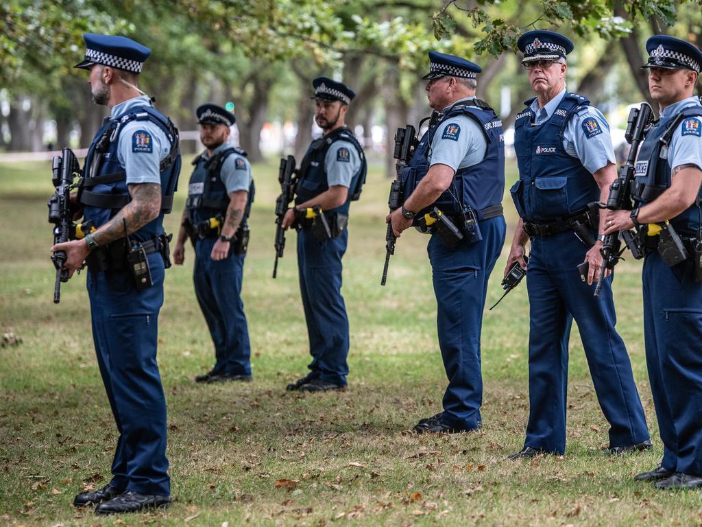 Police officers carrying automatic rifles guard the area near Al Noor mosque during a visit by Turkey's Vice-President Fuat Oktay and Foreign Minister Mevlut Cavusoglu. Picture: Getty