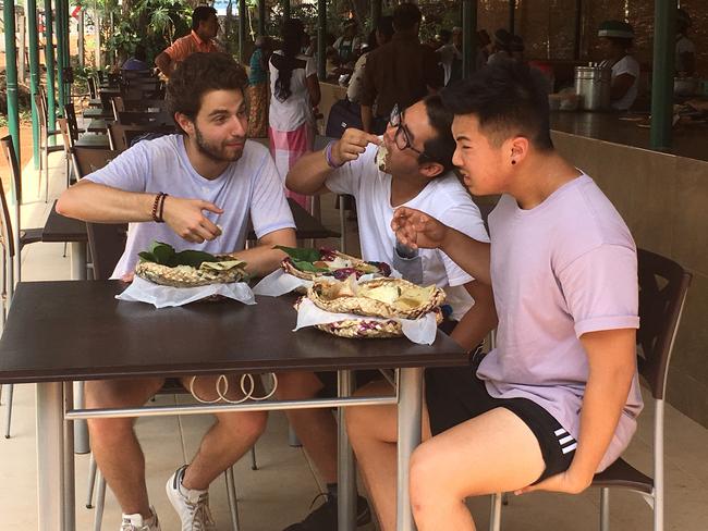 Kev, Dorian and Teng try the local fare — sans utensils.