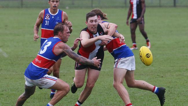 Bulldogs' Josh Matulis (left) and Saints' Jake O'Halloran (right) compete for the loose ball in the AFL Cairns Men's premiership match between the Cairns Saints and the Centrals Trinity Beach Bulldogs, held at Griffiths Park, Manunda. Picture: Brendan Radke