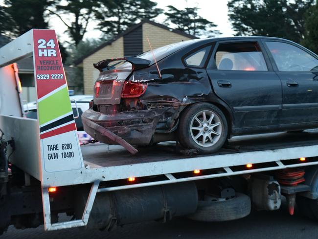 Police impound a car. Picture: Ian Wilson