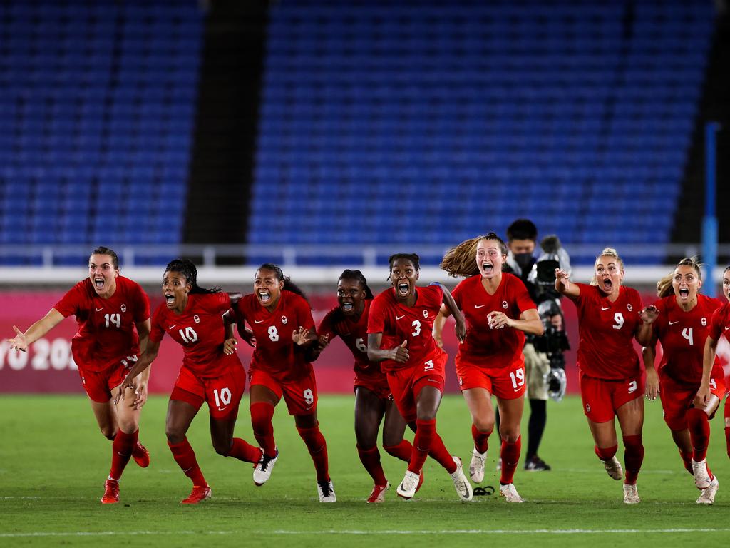 Canada celebrates the victory after the penalty shoot out. (Photo by Zhizhao Wu/Getty Images)