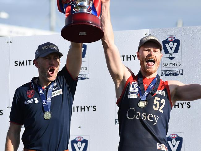 MELBOURNE, AUSTRALIA - SEPTEMBER 18: Mark Corrigan, coach of the Casey Demons and Mitch White of the Casey Demons celebrate after the 2022 VFL Grand Final match between the Casey Demons and the Southport Sharks at Ikon Park on September 18, 2022 in Melbourne, Australia. (Photo by Felicity Elliott/AFL Photos via Getty Images)