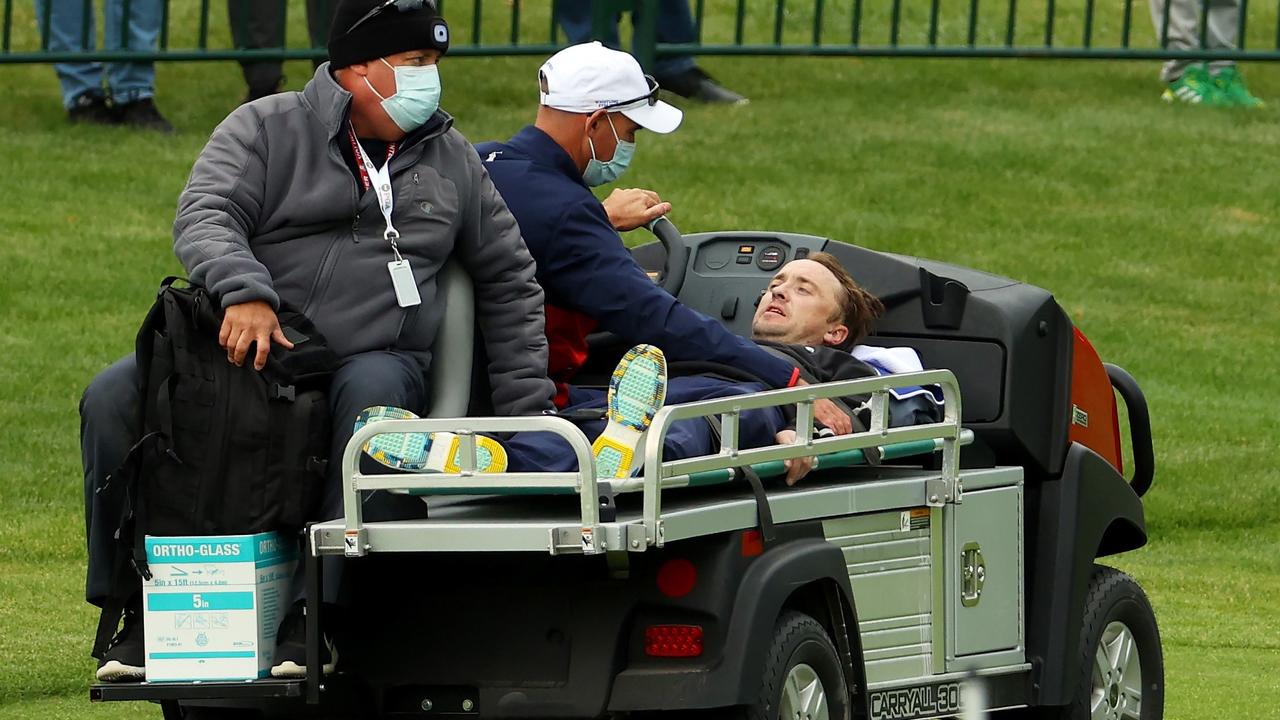 Felton was conscious as he was taken from the course. Picture: Andrew Redington/Getty Images/AFP