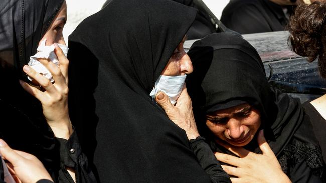 Family of a worker at the port of Beirut who was killed in the massive explosionlast week mourn during his funeral in southern Lebanon. Picture: AFP