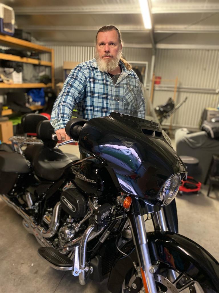 Former Navy Lieutenant Commander Tim Stroud and his beloved bike. Picture: Supplied