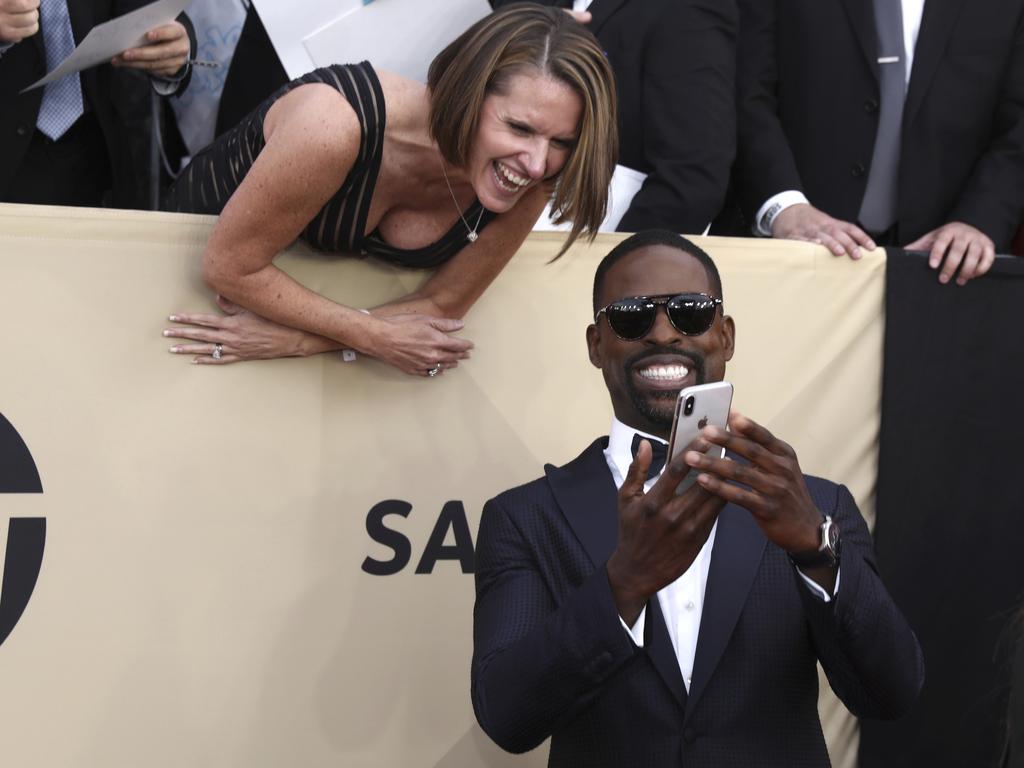 Sterling K. Brown takes a photo with a fan at the 24th Annual Screen Actors Guild Awards at The Shrine Auditorium on January 21, 2018 in Los Angeles, California. Picture: AP