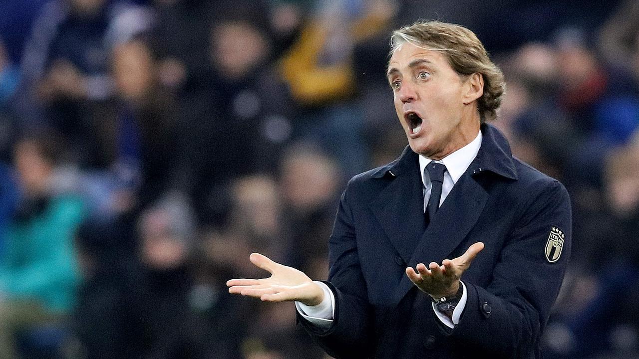 TOPSHOT - Italy's head coach Roberto Mancini reacts during the FIFA World Cup 2022 round one Group C qualification football match between Northern Ireland and Italy at Windsor Park in Belfast, Northern Ireland on November 15, 2021. (Photo by PAUL FAITH / AFP)