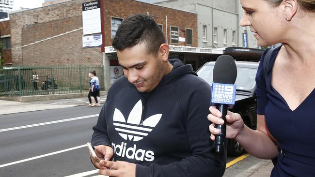 He filmed reporters while laughing off questions about his charges. Picture: John Appleyard