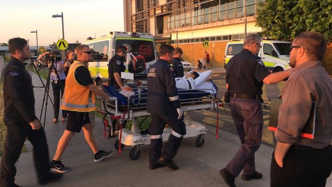 A man shot by police in Bowen is loaded onto a stretcher. Source: Channel 9/Twitter