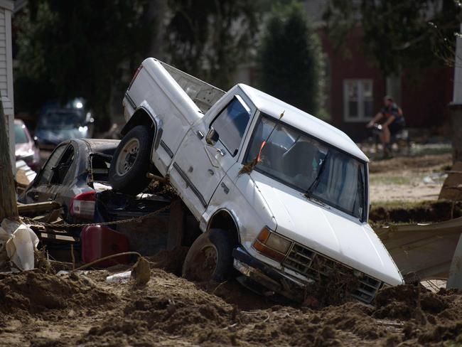 Two vehicles lie upended from flooding in the aftermath of Hurricane Helene in Old Fort, North Carolina. Picture: AFP