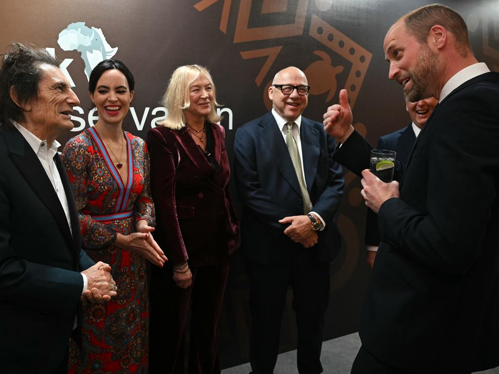 The royal meets Ronnie Wood and Mark Knopfler ahead of the ceremony. Picture: Getty Images