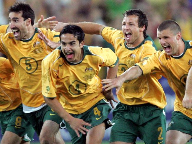 Soccer - Socceroos players celebrate after John Aloisi kicked winning penalty goal as Australia defeated Uruguay 4-2 in a penalty shoot-out at Tesltra Stadium in Sydney to qualify for 2006 FIFA World Cup in Germany.