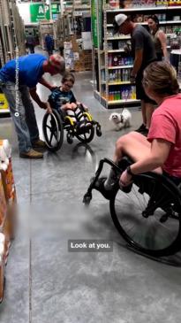 Boy in wheelchair learns to do wheelies