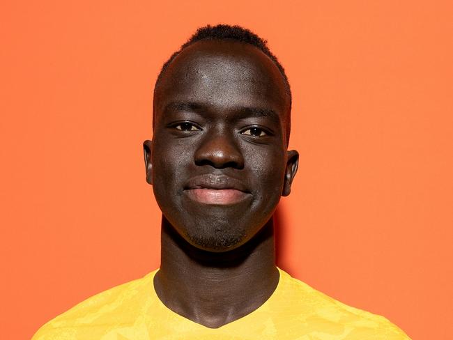 DOHA, QATAR - NOVEMBER 15: Awer Mabil of Australia poses during the official FIFA World Cup Qatar 2022 portrait session on November 15, 2022 in Doha, Qatar. (Photo by Ryan Pierse - FIFA/FIFA via Getty Images)