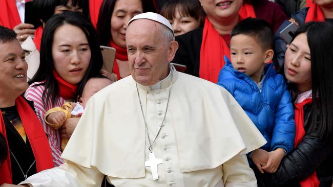 Pope Francis greets faithful from China as he arrives for his weekly general audience on April 18, 2018, on St. Peter's square in the Vatican.  / AFP PHOTO / TIZIANA FABI