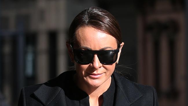 Television personality and fitness trainer Michelle Bridges arrives to the Downing Centre Court in Sydney. Picture: David Moir/AAP