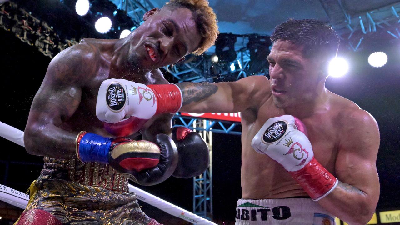 Jernell Charlo takes a punch from Brian Castano (right). Picture: Jayne Kamin-Oncea/Getty Images