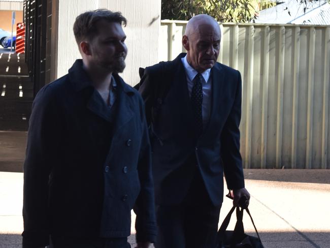 Oliver Deighton (left) and defence barrister Scott Corish walking into the Alice Springs Supreme Court on Monday.