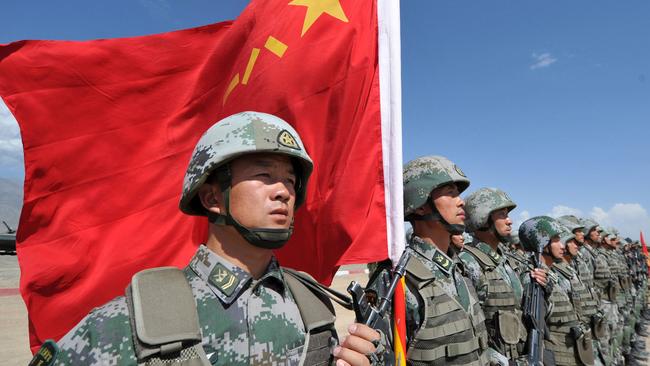 A soldier holds a Chinese flag. Picture: AFP